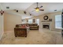 Spacious living room featuring a vaulted ceiling and cozy fireplace at 265 Oak Hill Dr, Covington, GA 30016
