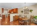 Cozy dining area featuring hardwood floors and a view to the kitchen at 224 Prominent Loop, Mcdonough, GA 30253
