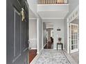 Inviting foyer with soaring ceilings, neutral paint colors, and a view into the home's living spaces at 1185 Charter Club Dr, Lawrenceville, GA 30043