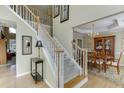 Bright foyer with hardwood floors and staircase leading to the second floor at 352 Hickory Haven Ter, Suwanee, GA 30024