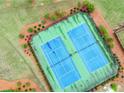 Overhead view of community tennis courts, showcasing well-maintained facilities for residents' recreational enjoyment at 6915 Rambling Vale, Cumming, GA 30028