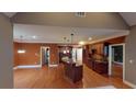Open-concept kitchen with an island, granite countertops, and abundant cabinet space at 4255 Ben Hill Rd, Atlanta, GA 30349
