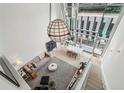 Open-concept living room boasts soaring ceilings, large windows, and stylish decor and furnishings at 845 Spring Nw St # 408, Atlanta, GA 30308