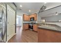 Efficient kitchen with wood cabinets, granite countertops, and stainless steel appliances at 832 Topaz Vly, Canton, GA 30114