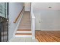 Bright entryway with staircase, wood floors, and neutral paint at 1227 Ashford Creek Ne Park, Atlanta, GA 30319