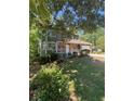 Charming two-story home with green siding, stone accents, and a well-maintained front yard at 5250 Mountain Village Ct, Stone Mountain, GA 30083