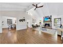 Bright living room with wood floors, stone fireplace, and high ceilings with exposed beams at 2929 Alberta Dr, Marietta, GA 30062