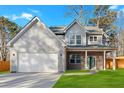 Charming two-story home featuring a spacious two-car garage and a welcoming covered front porch at 4806 Forest Trl, Douglasville, GA 30135
