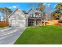 Charming two-story home featuring a spacious two-car garage and a welcoming covered front porch at 4806 Forest Trl, Douglasville, GA 30135
