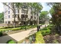 Landscaped garden path leading to building with beautiful trees and greenery at 3475 Oak Valley Ne Rd # 2060, Atlanta, GA 30326