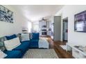 Open concept living room area with updated flooring, furnishings, paint and adjoined kitchen at 110 Turman Se Ave, Atlanta, GA 30315