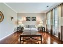Comfortable living room with hardwood floors and a neutral color scheme that is lit by a window at 3363 Linton Ln, Marietta, GA 30066