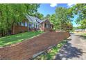Attractive brick home with well-maintained yard and driveway access at 3695 Highway 140, Rydal, GA 30171