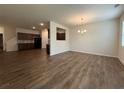 Spacious living room with wood floors, chandelier, and lots of natural light at 2335 Hackamore Dr, Atlanta, GA 30349