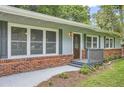 Attractive single story home with brick accents, a welcoming entrance, and beautiful curb appeal at 2648 Woodacres Ne Rd, Atlanta, GA 30345
