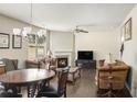 Living room with hardwood floors, ceiling fan, fireplace, and neutral walls at 3013 Nicholas Dr, Villa Rica, GA 30180