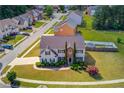 Spacious home with large yard, mature trees, and neighborhood views from above at 1043 Lexus Dr, Lawrenceville, GA 30045
