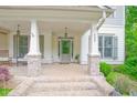 Charming front porch featuring brick accents, and a welcoming entryway at 533 Beecham Dr, Smyrna, GA 30082