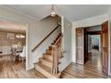 Inviting foyer with hardwood floors, a staircase, and views into the dining room at 1450 Holly Bank Cir, Atlanta, GA 30338