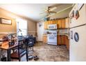 Modest kitchen features appliances, light wood cabinetry and adjacent dining space at 120 Turman Se Ave, Atlanta, GA 30315