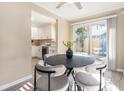Cozy dining area featuring a sliding glass door leading to a patio, modern furnishings, and natural light at 136 Peachtree Memorial Nw Dr # Va2, Atlanta, GA 30309