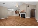 Spacious living room with hardwood floors, fireplace, and open floor plan with plenty of natural light at 226 Hames Rd # 335, Woodstock, GA 30188