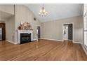 Bright living room with hardwood floors, a fireplace, and high ceilings with lots of natural light at 226 Hames Rd # 335, Woodstock, GA 30188