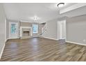 Spacious living room with updated flooring, fireplace, and plenty of natural light at 2417 Jade Dr, Lawrenceville, GA 30044