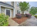 View of the front entrance, showcasing a well-maintained walkway and garden at 3733 Sidney Lanier Blvd, Duluth, GA 30096