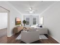 Comfortable living room featuring hardwood floors, a ceiling fan, and plenty of natural light at 10 Perimeter Summit Ne Blvd # 3109, Atlanta, GA 30319