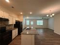 Modern kitchen with white cabinets, granite countertops, stainless steel appliances, and a convenient island at 2285 Crossrail Dr, Atlanta, GA 30349