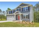 Two-story home featuring gray siding, black shutters, and a well-manicured lawn at 8491 Limerick Ln, Winston, GA 30187