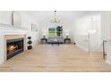 Bright living room with fireplace, large windows, and hardwood floors at 223 Old Alabama Se Rd, Emerson, GA 30137