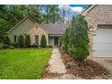 A charming exterior view showcases the brick and siding details of this lovely home at 1642 Ashmar Sw Ln, Marietta, GA 30064