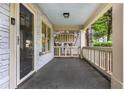 Inviting covered porch with classic columns and ample space for outdoor seating at 1761 Flat Shoals Se Rd, Atlanta, GA 30316