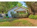 Beautiful home with a well-manicured front yard, trimmed hedges, and charming curb appeal at 1761 Flat Shoals Se Rd, Atlanta, GA 30316