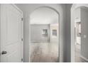 Bright entryway showcasing an archway, light wood floors, and neutral paint at 458 Ajo Way, Dallas, GA 30157