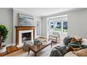 Cozy living room with hardwood floors, a fireplace, stylish furnishings, and bright natural light at 1100 Faith Se Ave, Atlanta, GA 30316