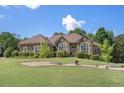 Charming home with mature landscaping and manicured lawn at 2628 Hollow Pne, Conyers, GA 30094