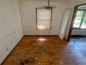 Dining room featuring hardwood flooring, a window, and a ceiling light at 668 Lynn Sw Cir, Atlanta, GA 30311