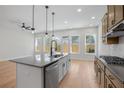 Spacious eat-in kitchen featuring stainless steel appliances, center island and backyard access at 2560 Silver Star Ne Dr, Marietta, GA 30066