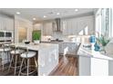 Bright kitchen with large island, stainless steel appliances, and sleek white and gray cabinetry at 2610 Lisa Sw Dr, Atlanta, GA 30311