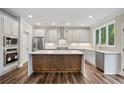 Modern kitchen featuring stainless steel appliances, a large center island, and plenty of cabinet space at 2610 Lisa Sw Dr, Atlanta, GA 30311