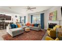 Inviting living room with fireplace, plush seating, and stylish decor at 6235 Crescent Landing Dr, Cumming, GA 30028