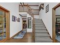 Welcoming foyer features hardwood floors, staircase, and views into other living spaces at 4373 Mikandy Nw Dr, Kennesaw, GA 30144