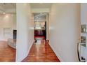 Hallway showing hardwood floors leading to kitchen and living room at , Mableton, GA 30126