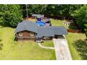 Aerial view of home, showcasing the backyard with a refreshing in-ground pool and spacious deck area at 173 Avalon Way, Riverdale, GA 30274