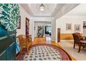 Bright foyer with hardwood floors, decorative rug and an open view into the living spaces at 1820 Habersham Gate Dr, Cumming, GA 30041