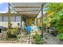 Outdoor patio area with a pergola, table, and chairs for relaxing and entertaining at 4720 Bill Cheek Rd, Auburn, GA 30011