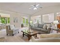 Spacious living room with a ceiling fan, neutral walls, and comfortable seating for relaxing or entertaining at 6805 Bransford Dr, Cumming, GA 30040